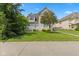 Traditional home with lush green lawn, mature trees, and walkway leading to the entrance at 608 East 21St St, Indianapolis, IN 46202