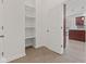 Entry hallway shows coat closet and doorway into kitchen with light flooring at 608 East 21St St, Indianapolis, IN 46202