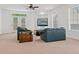 Bright living room with plush seating, built-in shelving, and access to the outdoors at 608 East 21St St, Indianapolis, IN 46202