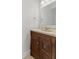 Elegant powder room featuring a wood vanity and stylish fixtures at 608 East 21St St, Indianapolis, IN 46202