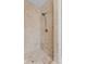 Shower featuring travertine tile surround and modern shower head at 608 East 21St St, Indianapolis, IN 46202