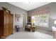 Inviting bedroom with natural light, comfortable seating, and stylish window treatments at 6150 Rolling Rock Ln, Noblesville, IN 46062