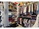 Walk-in closet with custom shelving for organizing clothes, shoes, and accessories at 6150 Rolling Rock Ln, Noblesville, IN 46062