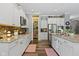 Well-lit kitchen with white cabinets, stainless steel appliances, granite countertops, and a walk-in pantry at 6150 Rolling Rock Ln, Noblesville, IN 46062
