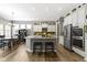 Spacious kitchen with a large island, stainless steel appliances, and an adjacent dining area at 6150 Rolling Rock Ln, Noblesville, IN 46062