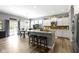 Open kitchen featuring a center island with bar stools and modern appliances at 6150 Rolling Rock Ln, Noblesville, IN 46062