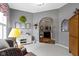 Bright living room featuring a decorative cabinet, comfortable seating, and a cozy atmosphere at 6150 Rolling Rock Ln, Noblesville, IN 46062