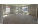 Spacious bedroom featuring ample natural light from multiple windows, ready for your personal touch and customization at 6306 Countryside Forge Way, Indianapolis, IN 46259