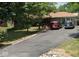 Charming single-story home with a well-manicured lawn and a paved driveway for ample parking at 6430 E Stop 11 Rd, Indianapolis, IN 46237