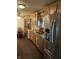 Spacious kitchen featuring stainless steel appliances, wooden cabinetry, and a cozy breakfast nook at 6430 E Stop 11 Rd, Indianapolis, IN 46237