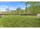 Spacious grassy backyard great for outdoor activities at 6464 Whitley Ln, Indianapolis, IN 46260