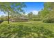 Secluded backyard offers a serene outdoor setting at 6464 Whitley Ln, Indianapolis, IN 46260