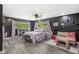 Spacious bedroom with views of the outdoor greenery, wood floors, and decorative touches at 6464 Whitley Ln, Indianapolis, IN 46260