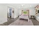 Bedroom with four-poster bed, patterned rug, and eclectic decor at 6464 Whitley Ln, Indianapolis, IN 46260