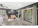 Bedroom with custom closet, hardwood flooring, and a cozy seating area at 6464 Whitley Ln, Indianapolis, IN 46260