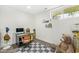 Bedroom with a large teddy bear, office area, and large window at 6464 Whitley Ln, Indianapolis, IN 46260