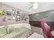 Whimsical bedroom with cozy seating, creative decor, and an inviting atmosphere for relaxation at 6464 Whitley Ln, Indianapolis, IN 46260