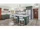 Modern kitchen with green cabinets, stainless steel appliances, and pendant lighting at 6464 Whitley Ln, Indianapolis, IN 46260