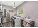 Functional laundry room featuring modern washer and dryer units, with convenient storage solutions at 6464 Whitley Ln, Indianapolis, IN 46260