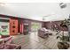 Unique living room with a vintage candy machine, wood floors, and outdoor access at 6464 Whitley Ln, Indianapolis, IN 46260