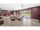 Open-concept living room with wood floors, recessed lighting and backyard access at 6464 Whitley Ln, Indianapolis, IN 46260