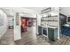 Inviting living area with modern cabinetry, floating shelves and an open floor plan at 6464 Whitley Ln, Indianapolis, IN 46260