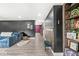 Open living area with dark accent wall, decorative shelving and comfortable seating at 6464 Whitley Ln, Indianapolis, IN 46260