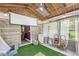 Relaxing porch featuring ample natural light and unique design elements, perfect for outdoor living at 6464 Whitley Ln, Indianapolis, IN 46260