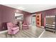 Cozy sitting area with comfortable pink chairs and a vintage candy machine at 6464 Whitley Ln, Indianapolis, IN 46260