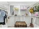Spacious walk-in closet featuring custom shelving and organization solutions for efficient storage and display at 6464 Whitley Ln, Indianapolis, IN 46260