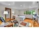 Inviting bedroom with hardwood floors, natural light, closet, and a comfortable sitting area for relaxing and unwinding at 6465 Lawrence Dr, Indianapolis, IN 46226