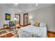 Charming bedroom featuring hardwood floors, natural light, and easy access to an adjoining bathroom at 6465 Lawrence Dr, Indianapolis, IN 46226