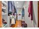 Walk-in closet with custom shelving and wooden floors. Perfect for organizing clothes and shoes at 6465 Lawrence Dr, Indianapolis, IN 46226