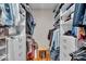 Walk-in closet featuring custom shelving and hardwood floors for optimal storage space at 6465 Lawrence Dr, Indianapolis, IN 46226