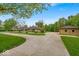 An impressive single story home with circle drive and three car detached garage on a landscaped lawn at 6465 Lawrence Dr, Indianapolis, IN 46226