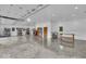 Spacious garage with high ceilings, concrete floors, work benches, and plenty of storage at 6465 Lawrence Dr, Indianapolis, IN 46226