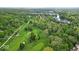 Beautiful aerial view of a golf course with mature trees, ponds and lush green fairways at 6465 Lawrence Dr, Indianapolis, IN 46226
