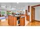 Well-appointed kitchen with a center island, wood cabinets, and an open layout for easy entertaining at 6465 Lawrence Dr, Indianapolis, IN 46226