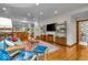 Spacious living room with hardwood floors and views of the modern media center at 6465 Lawrence Dr, Indianapolis, IN 46226