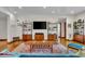 Living room features hardwood floors, a modern media center, and stylish decor at 6465 Lawrence Dr, Indianapolis, IN 46226