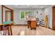 Office room featuring hardwood floors, natural light, and modern furnishings at 6465 Lawrence Dr, Indianapolis, IN 46226