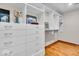 Walk-in closet with custom shelving and drawers, providing ample storage space at 6465 Lawrence Dr, Indianapolis, IN 46226