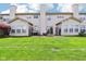 A large backyard with lush green grass, featuring a patio area, perfect for outdoor activities and enjoying nature at 7045 Gavin Dr, Indianapolis, IN 46217