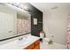 Bathroom features a vanity sink, toilet and tub with shower at 7045 Gavin Dr, Indianapolis, IN 46217