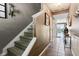 Inviting entryway featuring stairs, neutral paint, and tile flooring leading to the main living areas at 7045 Gavin Dr, Indianapolis, IN 46217