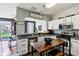 Inviting kitchen with stainless appliances, white cabinets and table with seating at 7045 Gavin Dr, Indianapolis, IN 46217