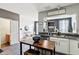 Bright kitchen showcases stainless steel appliances, white cabinets, and a casual breakfast bar at 7045 Gavin Dr, Indianapolis, IN 46217