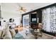 Inviting living room boasts hardwood floors, a cozy seating area, and a modern fireplace at 7045 Gavin Dr, Indianapolis, IN 46217