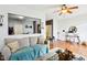 Spacious living area featuring hardwood floors, a comfortable couch, and access to the kitchen at 7045 Gavin Dr, Indianapolis, IN 46217