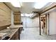 Unfinished basement workshop with pegboard wall storage and double doors at 7245 Highburry Dr, Indianapolis, IN 46256